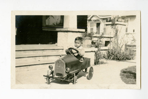 James Osamu with a toy car