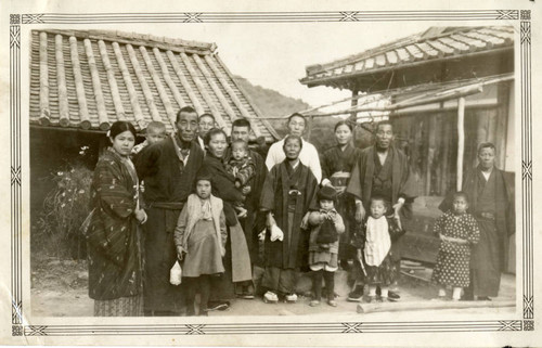 Family in front of House