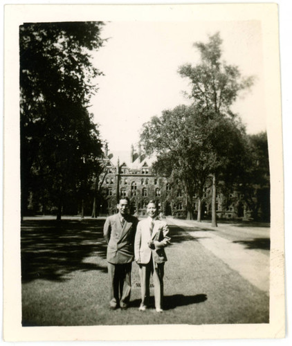 Mervyn Suzuki standing next to man