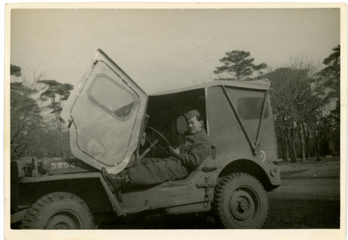 John Yoshinaga in military vehicle