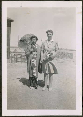 Two women, one woman wearing a kimono