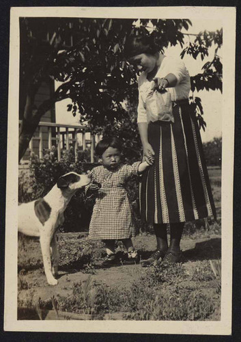 Woman and child in front yard