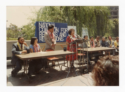 Sumi Seki speaking at NCRR press conference