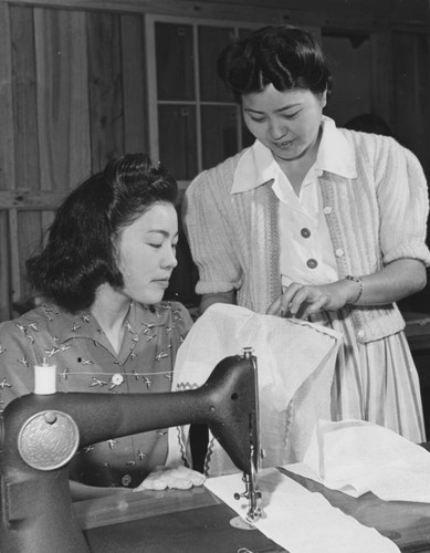 [Misae Oku receiving instruction from instructor, Mrs. Sadako Yasue]