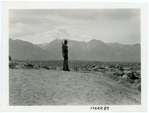 Photograph of a sentry guard at Manzanar Incarceration Camp