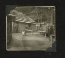 Man standing next to building