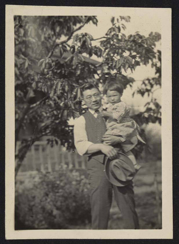 Man carrying young girl