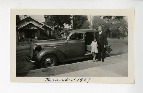 Tanjiro Saito, Emiko, and Joyce Teruko with a car