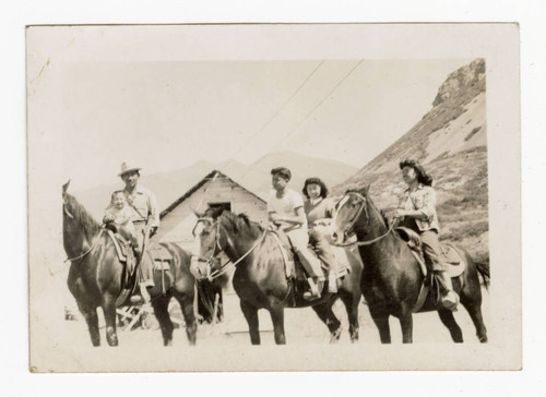 Margaret Yukiko Zumwinkle and three others riding horses