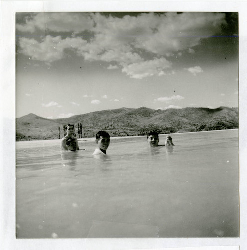 U.S. soldiers swimming in a river