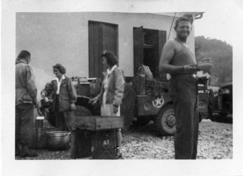 [Men in military uniform and women from American Red Cross]