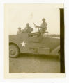 Men in military vehicle