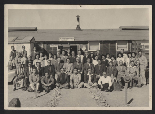 Group posing in front of Topaz Consumer Cooperative Enterprises, Inc