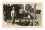 Tanjiro Saito with his children and chicken