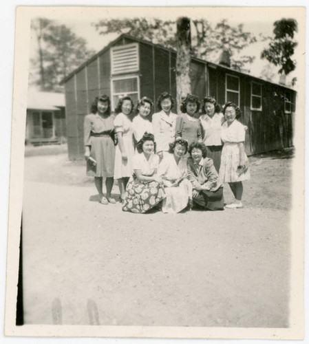 Young women in front of barrack