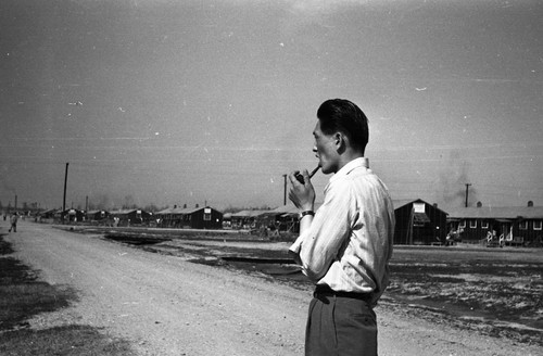 Man with pipe in Jerome camp