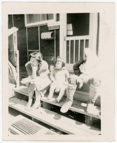 Woman and child sitting at incarceration camp