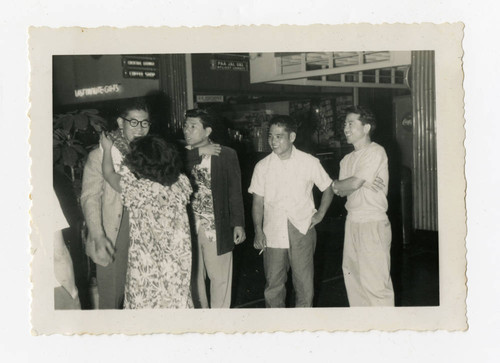 Woman giving Hideyuki Takamori a hug