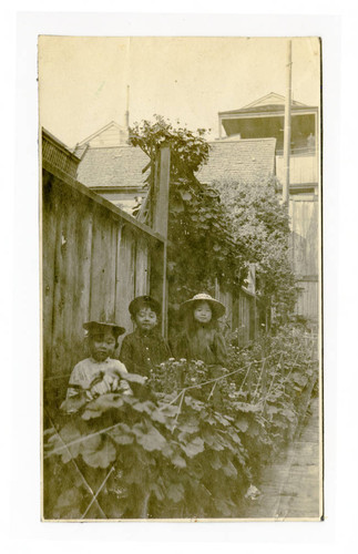 Nakao and Tatsuo Saito in a yard