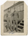 Staff Sergeant Minoru Frank Saito standing with fellow staff sergeant