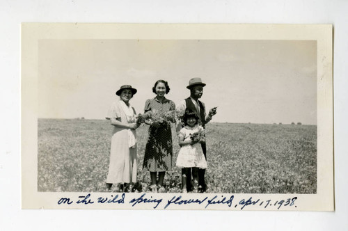 Tanjiro and Kiku Saito, Fumiko, and Joyce Teruko in flower fields