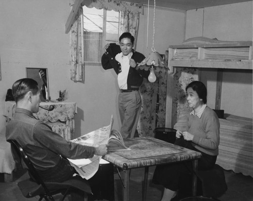 [Ninomiya family in their barracks room at Granada incarceration camp]