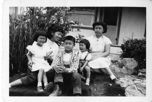 Family in front of House