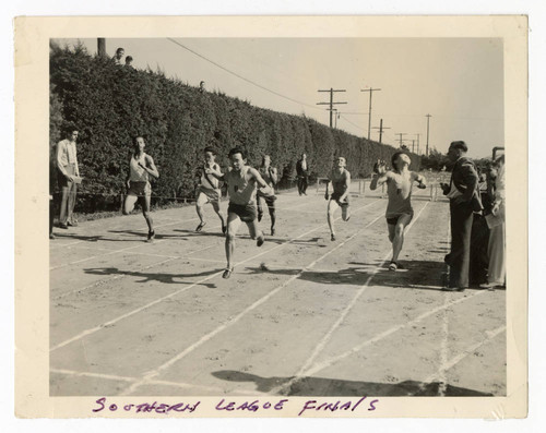 James Osamu Saito about to cross the finish line at the Southern League Finals