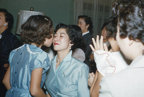 Women and girls playing a game at Little Miss Christmas party