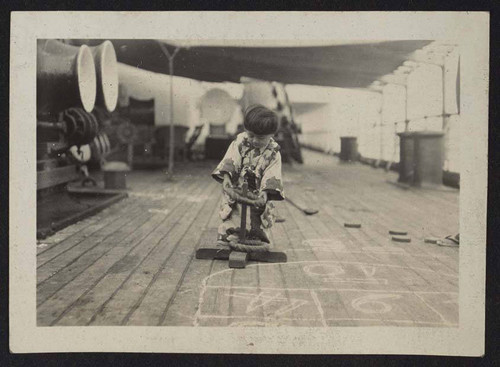 Child playing on a ship