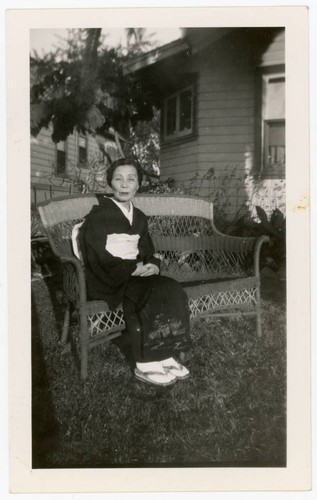 Shigeru Yoshinaga sitting on bench