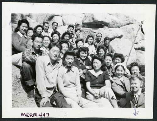 Photograph of a group of people, including Bernice Sibner, sitting on rocks in the Sierra Nevada