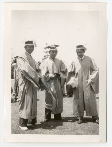 Young men in caps and gowns