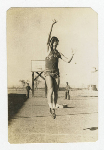 Nisei man performing jump shot