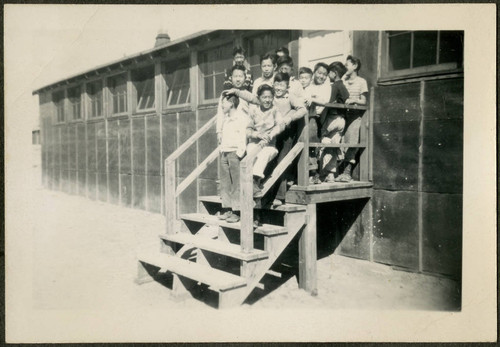 Group of male children on barrack stairs