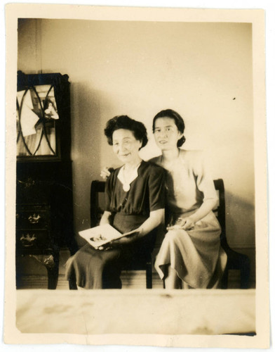 Shigeru Yoshinaga sitting next to woman