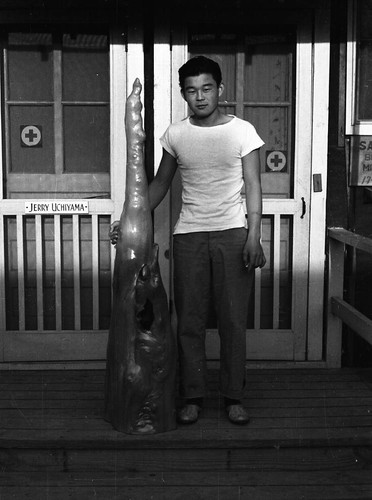 Man with sculpture in Jerome camp