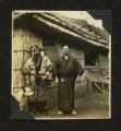 Two men in front of building