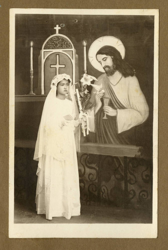 Japanese Peruvian female child in First Communion attire