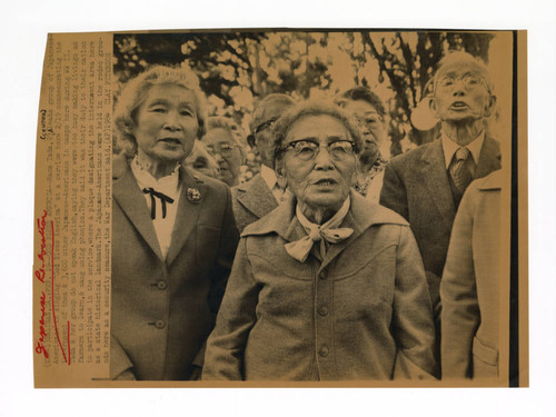 Hana Tada leading a group of Japanese Americans in singing "God Bless America" at a service in 1984