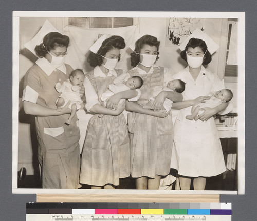 Stork Visits Relocation Center. The stork has paid frequent visits to the Tule Lake, Calif., Japanese Relocation Center since it was opened a year ago. Here are four new arrivals held by nurses (L-R) Mary Nitta, Loomis, Calif., Rudy Fujioki, Seattle Wash., Masako Nakadoi, Loomis, Calif., Katsumi Ogawa, Loomis, Calif