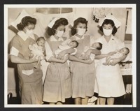 Stork Visits Relocation Center. The stork has paid frequent visits to the Tule Lake, Calif., Japanese Relocation Center since it was opened a year ago. Here are four new arrivals held by nurses (L-R) Mary Nitta, Loomis, Calif., Rudy Fujioki, Seattle Wash., Masako Nakadoi, Loomis, Calif., Katsumi Ogawa, Loomis, Calif