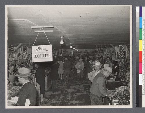 [Shoppers in camp store]