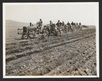 Potato Planting Time at Relocation Center. Using light tractors Japanese residents of the Relocation Center at Tule Lake, Calif., design planting potatoes in several hundred acres of fertile soil reclaimed Old Tule Lake [correct name for the lake). The residents are planting 835 acres in vegetables