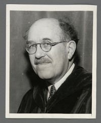 [Bust portrait of Otto Stern in academic gown.]