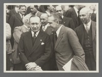 [Detail of those assembled for group portrait at Rome Conference on Nuclear Physics, including Paul Ehrenfest, back left with glasses, and Niels Bohr, front with smile.]