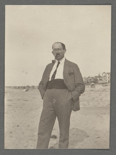 [Otto Stern on beach with pipe in mouth.]