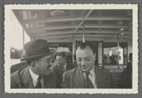 [Otto Stern on left speaking to Wolfgang Pauli on right, on excursion boat.]