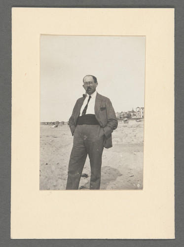 [Otto Stern on beach with pipe in mouth.]