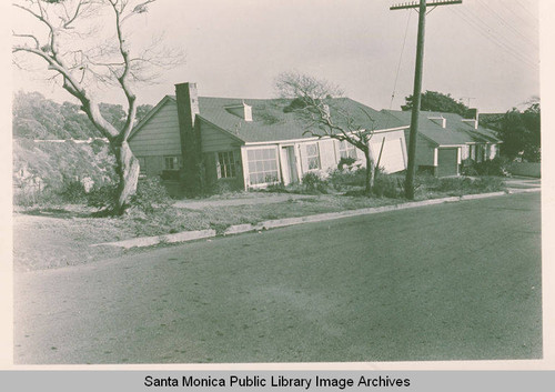 Landslide damage to a house on Friend Street slipping down into Potrero Canyon